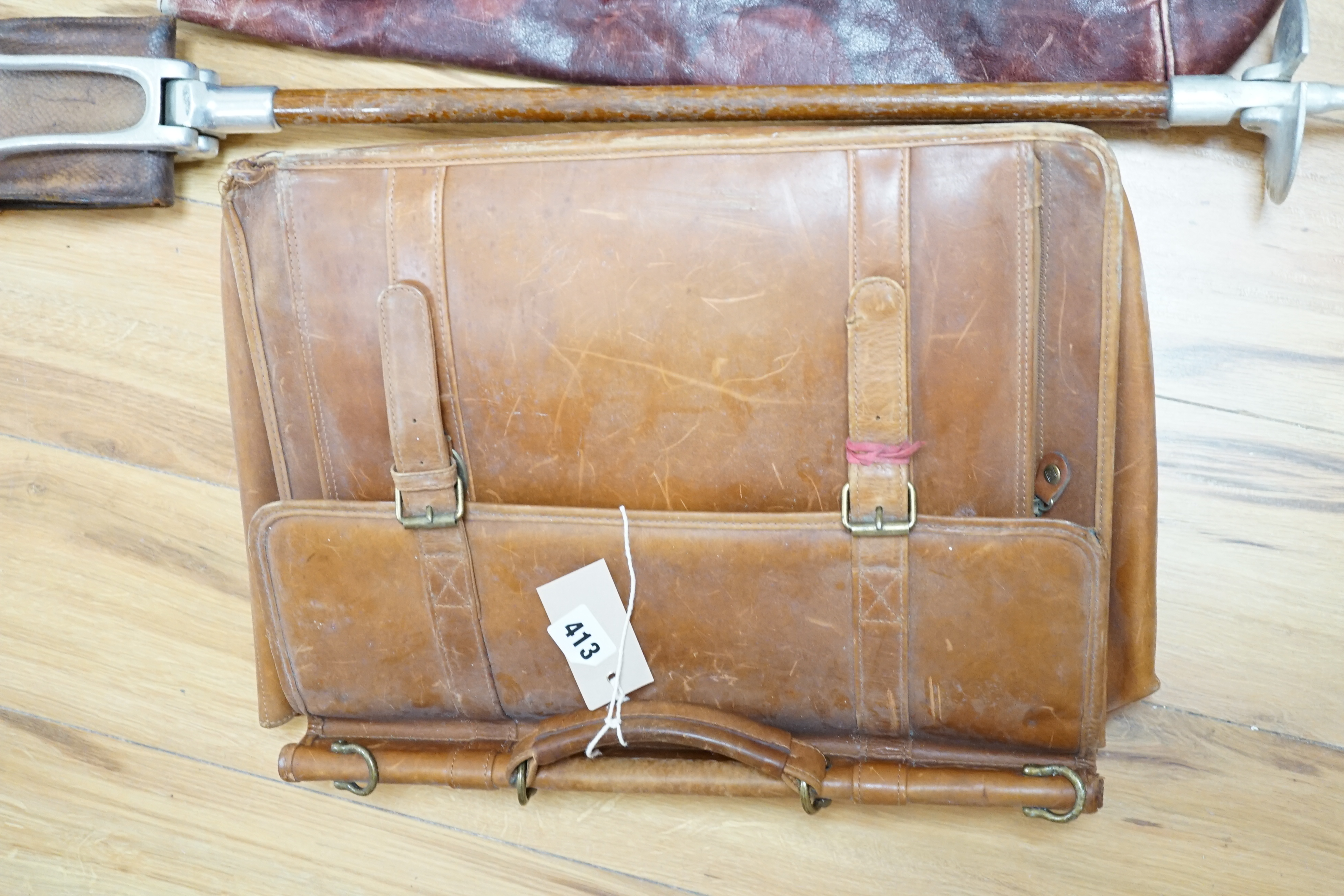 A leather Gladstone bag, an attaché case and a shooting stick